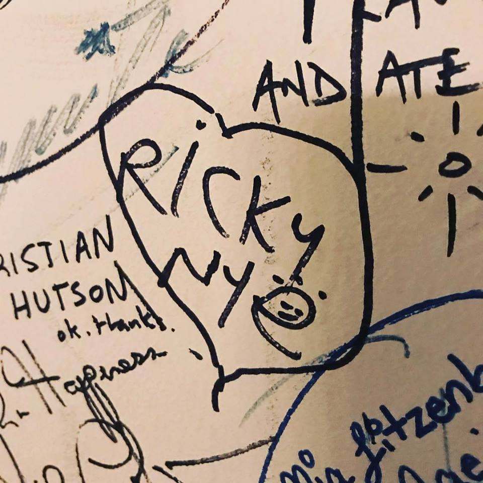 Ricky Nye standing against a brick wall